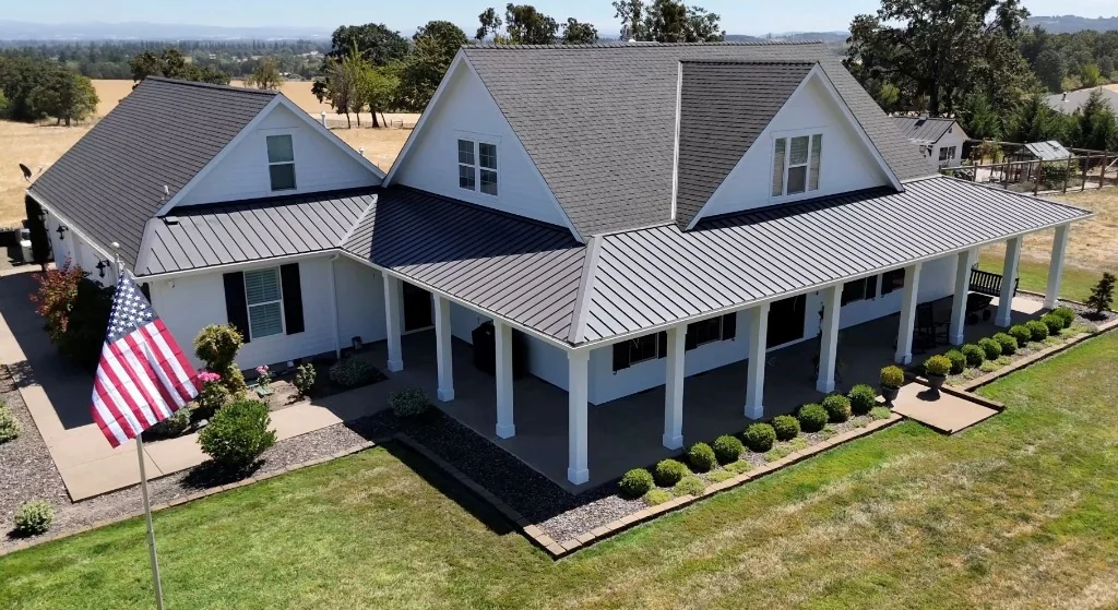 Modern farmhouse exterior painting with wrap-around porch